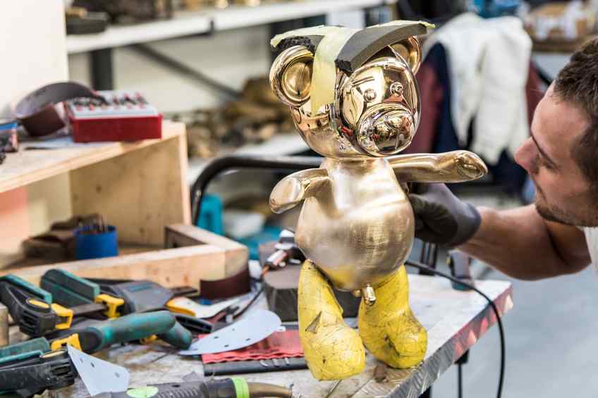 Working on the small Bare Hug in the studio - Bare Hug (polished bronze), 2016 by Joseph Klibansky
