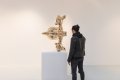 Joseph standing next to the large "Reflections of Youth" - Reflections of Youth (polished bronze), 2017 by Joseph Klibansky