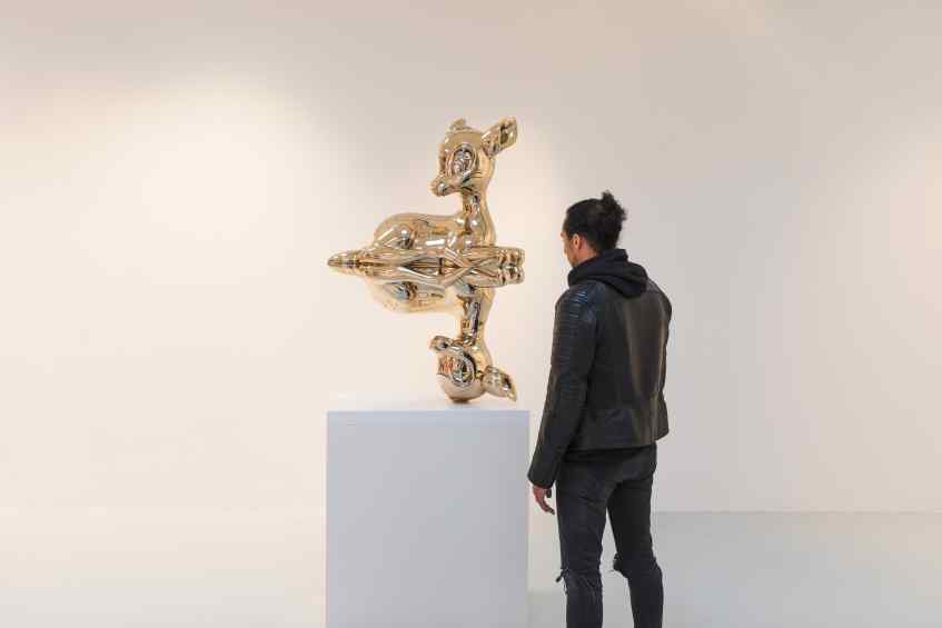 Joseph standing next to the large "Reflections of Youth" - Reflections of Youth (polished bronze), 2017 by Joseph Klibansky