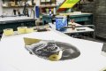 The small Big Bang screen print in the studio - Big Bang (edition, black/gold leaf), 2016 by Joseph Klibansky