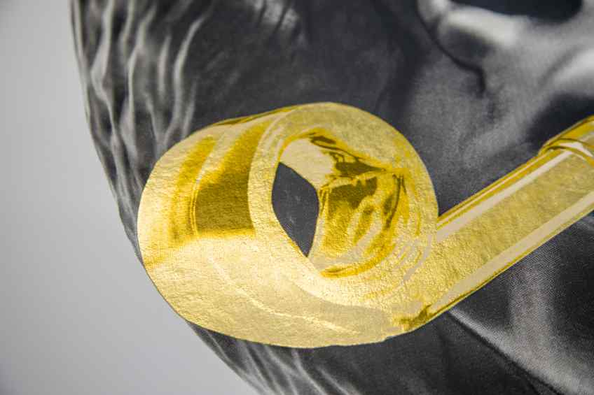 A detail of the gold leaf on the whistle on a small Big Bang screen print - Big Bang (edition, black/gold leaf), 2016 by Joseph Klibansky
