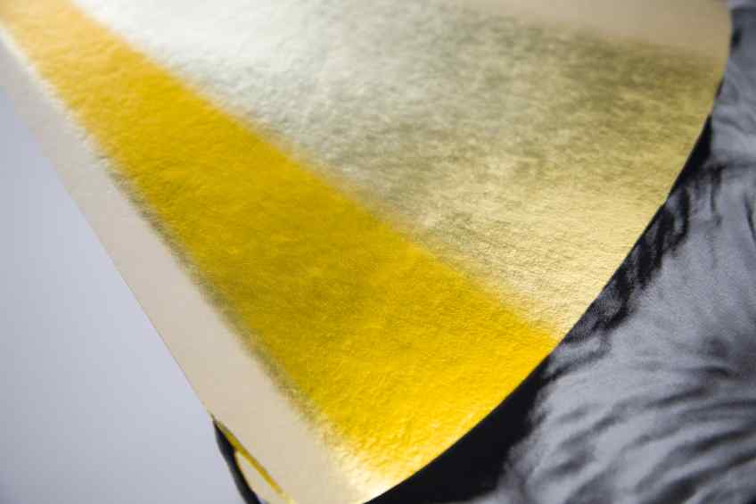 A detail of the gold leaf on the hat on a small Big Bang screen print - Big Bang (edition, black/gold leaf), 2016 by Joseph Klibansky