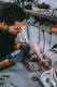 A studio assistent working on the sculpture "Happily Ever After" in Klibansky's Studio - Happily Ever After (bronze), 2018 by Joseph Klibansky