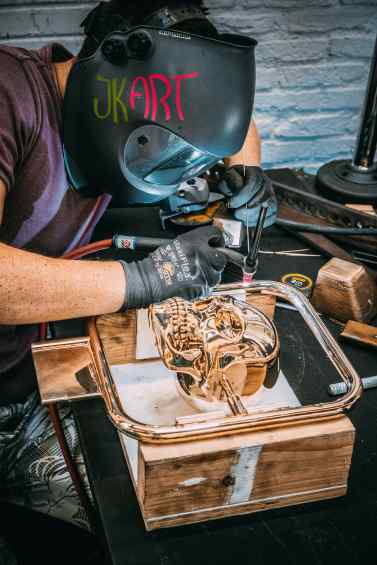 Studio assistant working on Elements of Immortality in the studio - Element of Immortality (polished bronze), 2018 by Joseph Klibansky