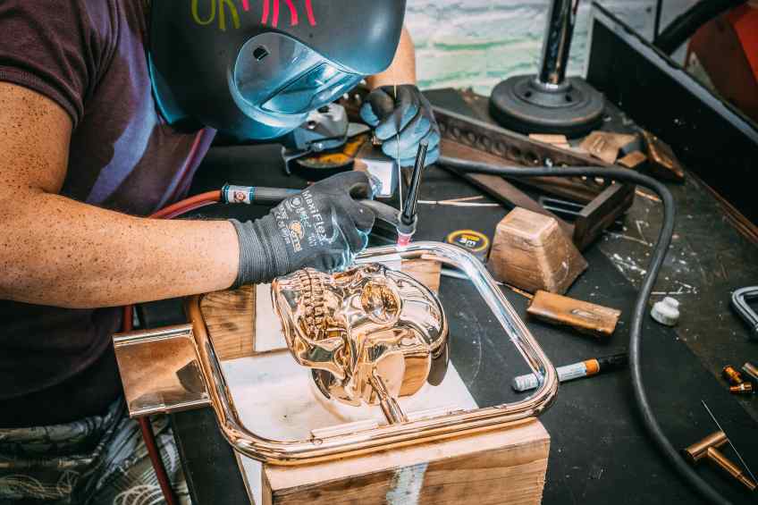 Studio assistant working on Elements of Immortality in the studio - Element of Immortality (polished bronze), 2018 by Joseph Klibansky